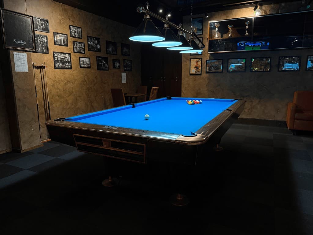 Billiards table area inside Omega